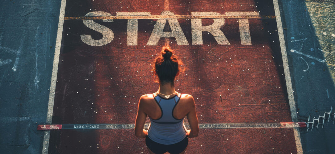 Female athlete stands on the starting line of the world athletics start