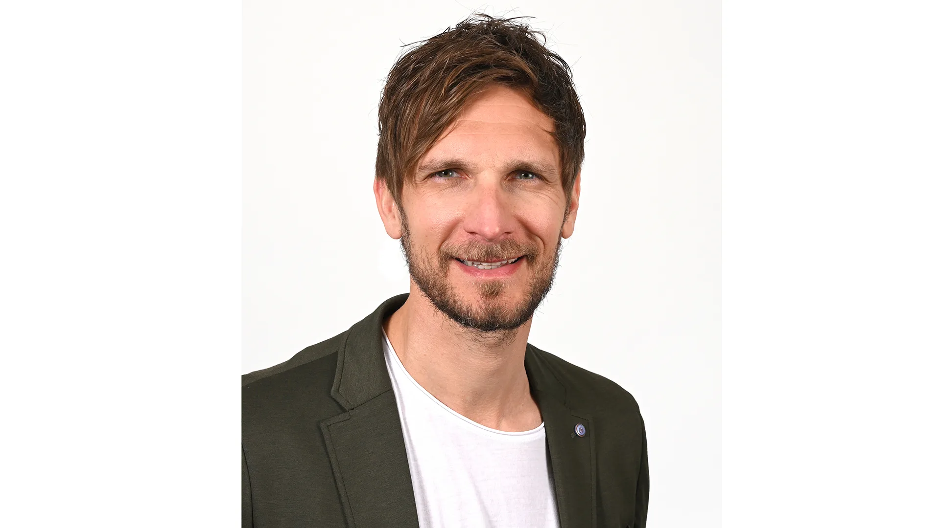 Marcel Brüggert lächelt in die Kamera.