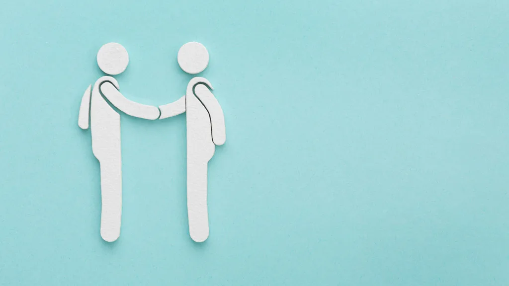 Illustration zweier Figuren, die sich die Hände schütteln.